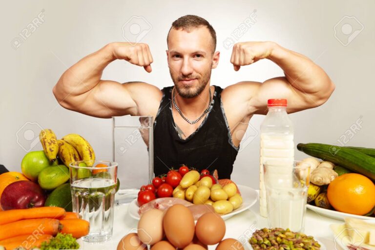 Healthy food for healthy fitness life - man in studio
